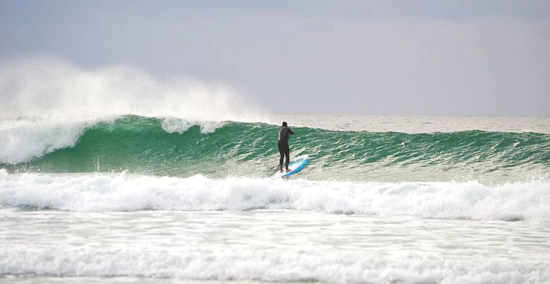 Joe on his hard paddle board in Tiree