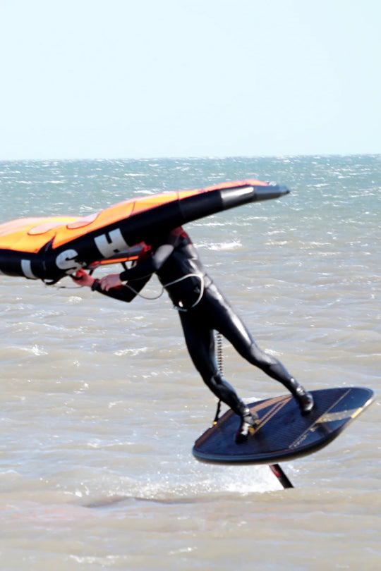 Hydrofoil board being gybed with wing
