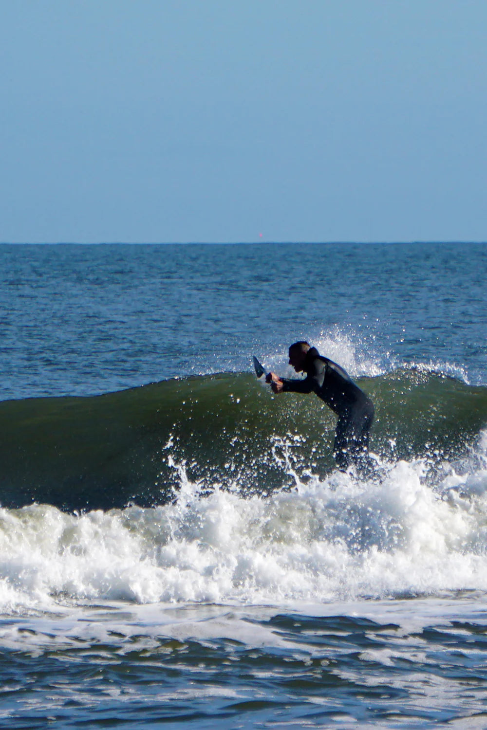 Joe races the line on his surf SUP