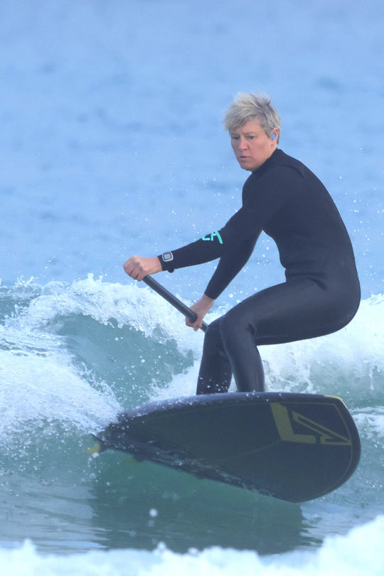 British Surf SUP Champ redirects on her surfing paddle board