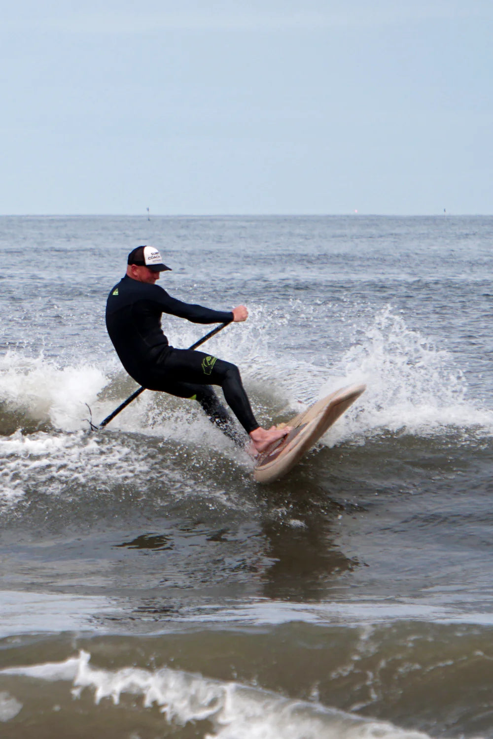 Nick throws spray on his surf SUP