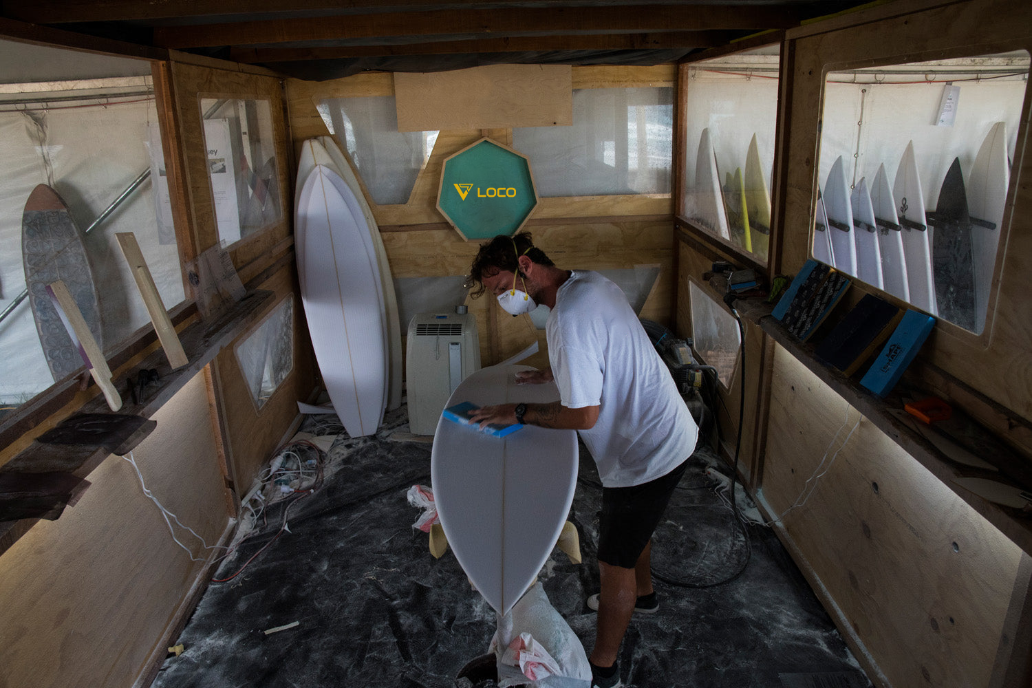 Loco's shaper crafting British SUP champion Aaron Rowe's custom stand up paddle board for surfing