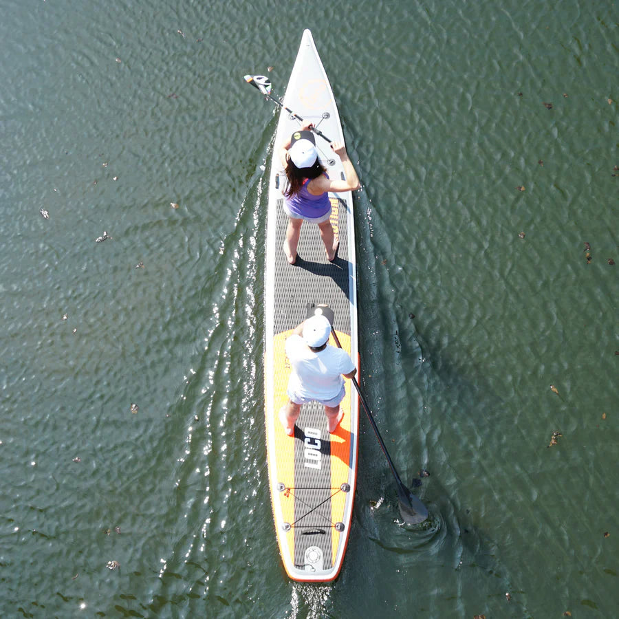 Couple ride their inflatable paddle board