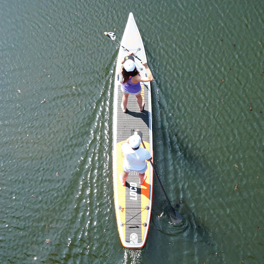 Couple ride their inflatable paddle board