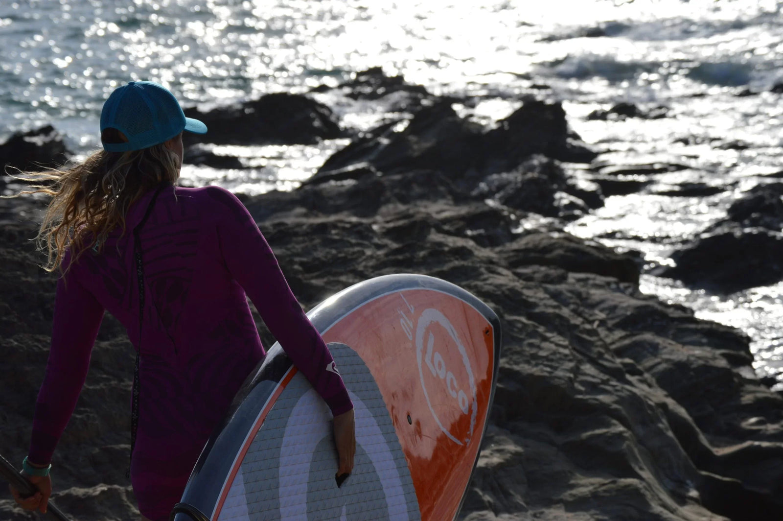 Tina Beresford with paddleboard, Paddle Surfing for Girls | Loco Surfing