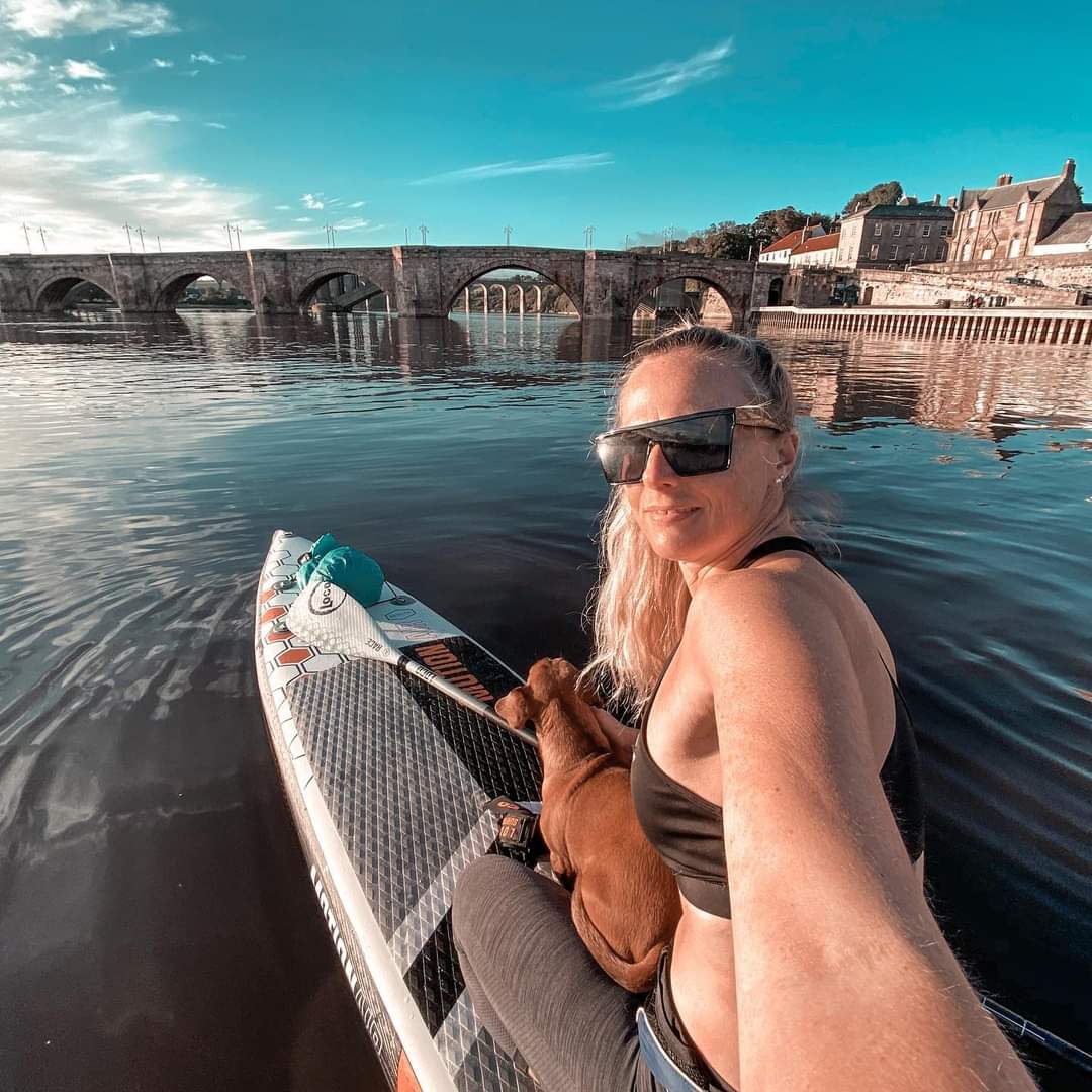 Kate and her sausage dog paddleboard Berwick