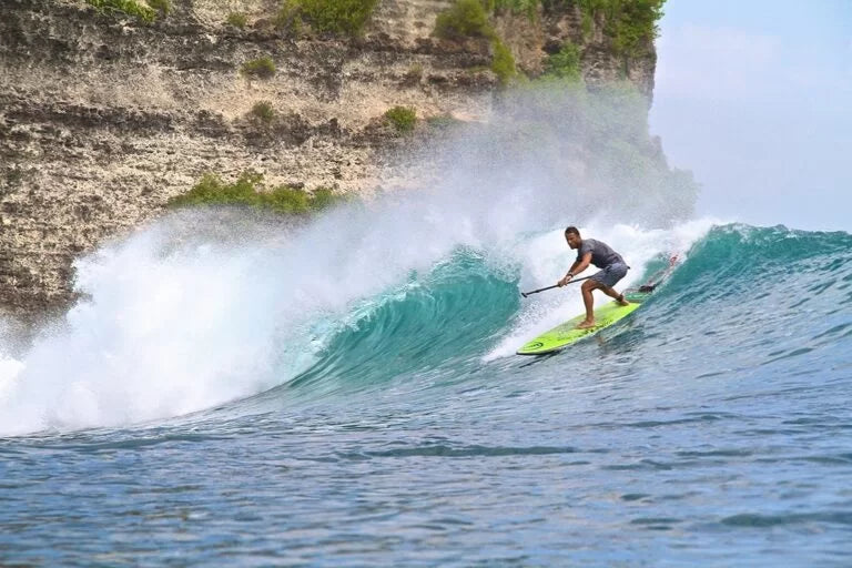 Jonny Slater paddlesurfing in Bali