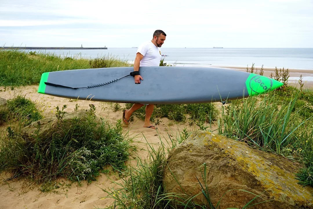 Phil May with his Loco racing stand up paddle board