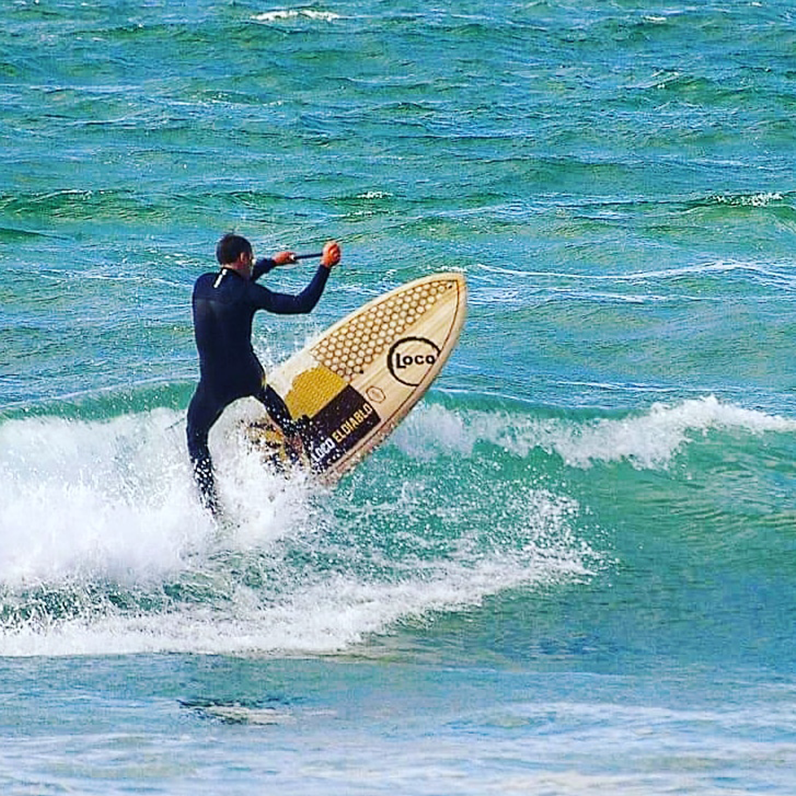 paddle surfer at watergate bay