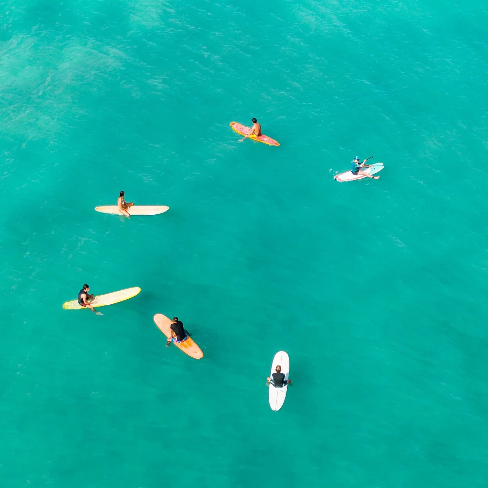 Paddleboarders wait for the set wave, The Ultimate Guide To Choosing The Right Paddleboard | Loco