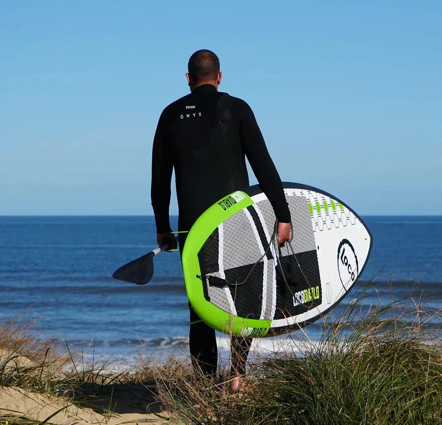 North East Surfer With His Paddle Board 