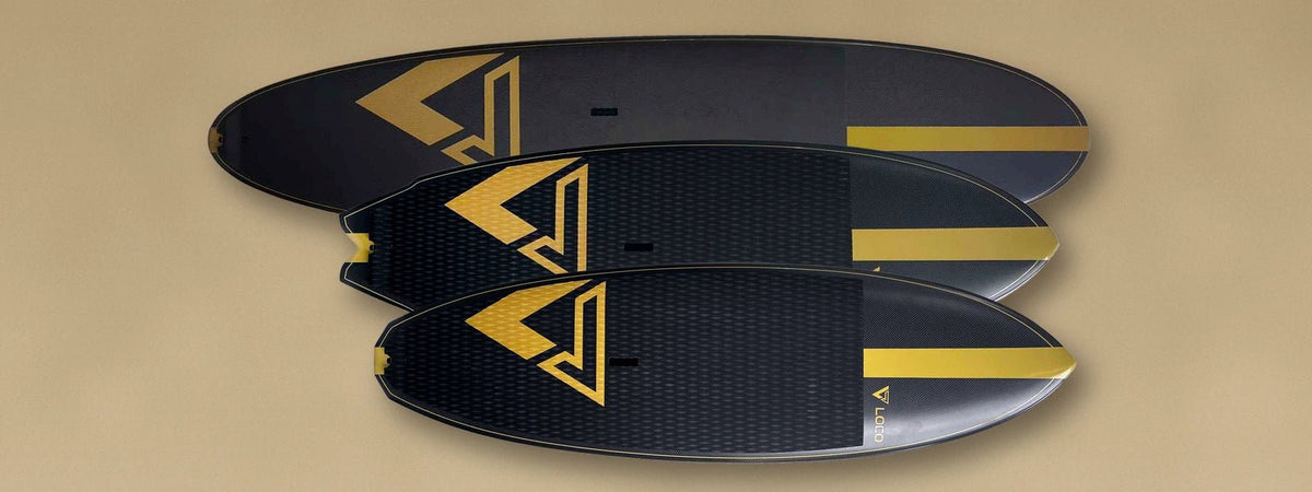 Three surf SUP shapes prepared beside a UK beach