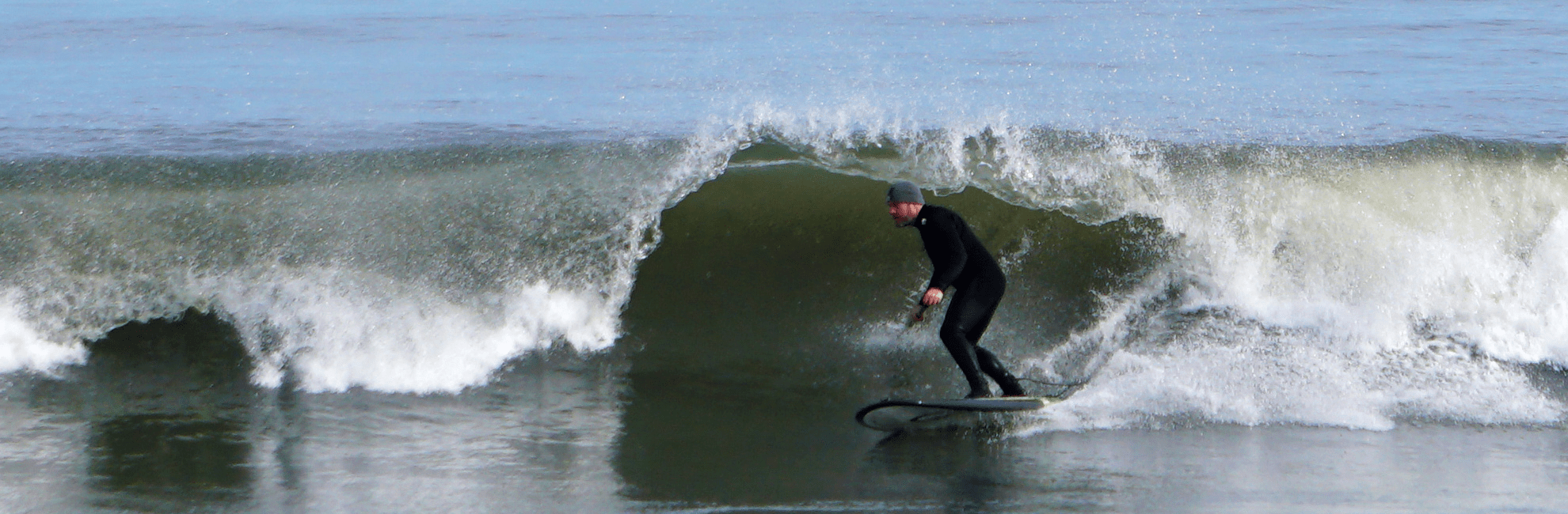 Guy on Carbon Stand UpPaddle Board Dodging The Lip