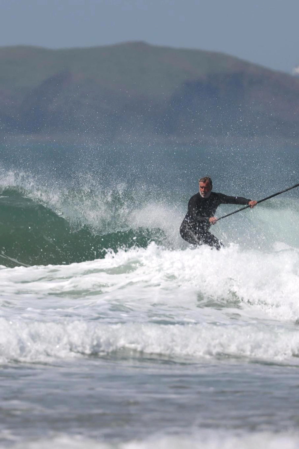 backside paddle surfing