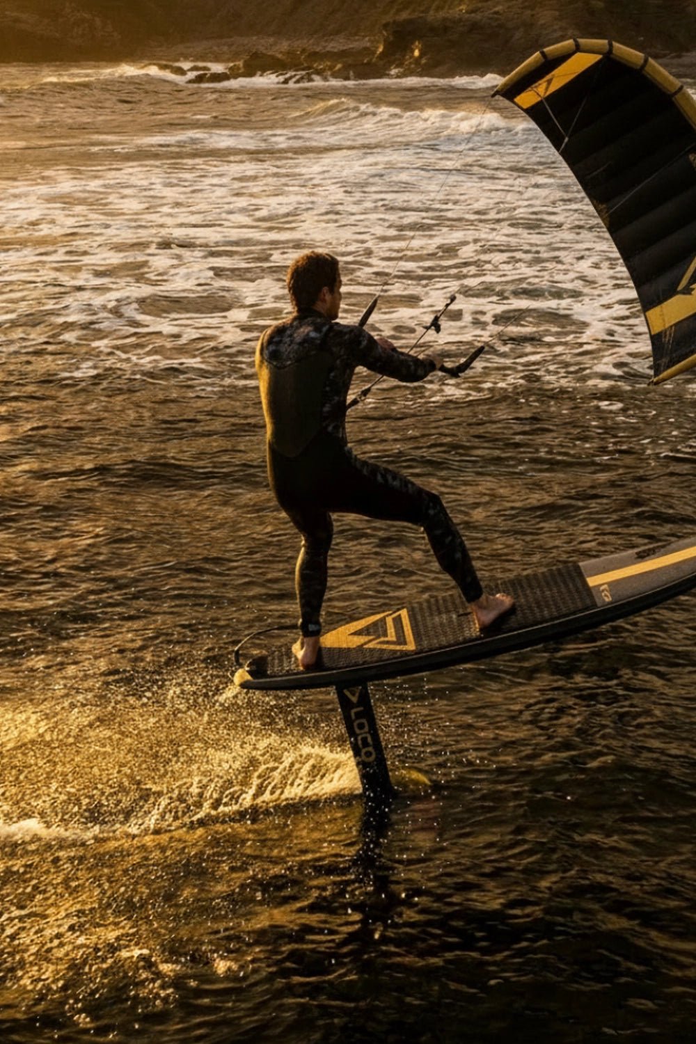 Guy fighting the wind with his para-wing while up on foil