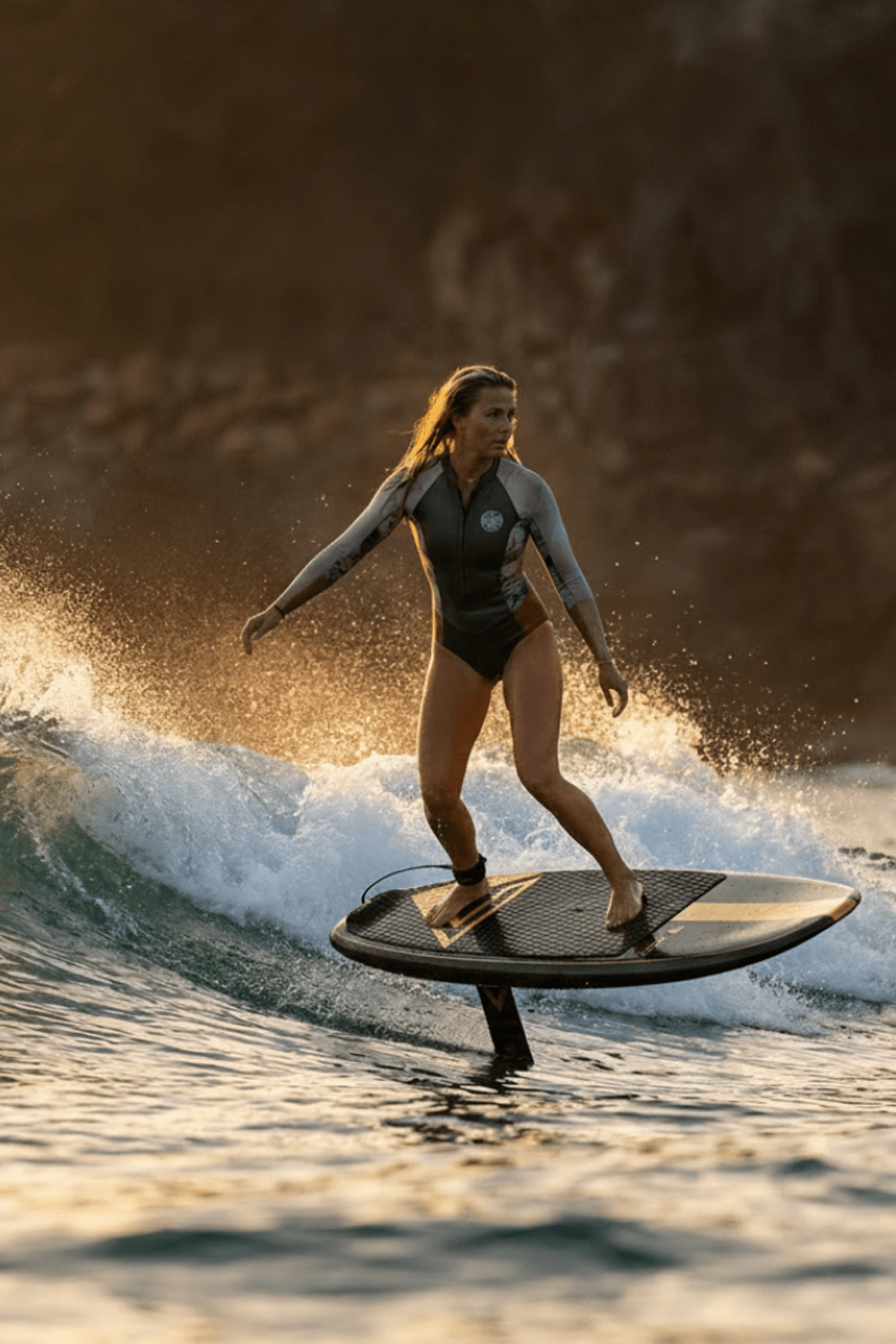 girl prone foiling a morning wave before work