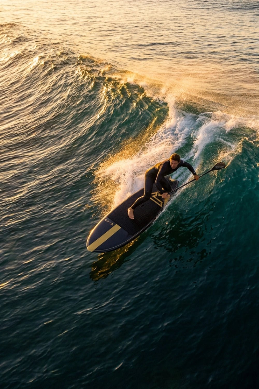 Guy SUP boarding on a wave with sunset lighting